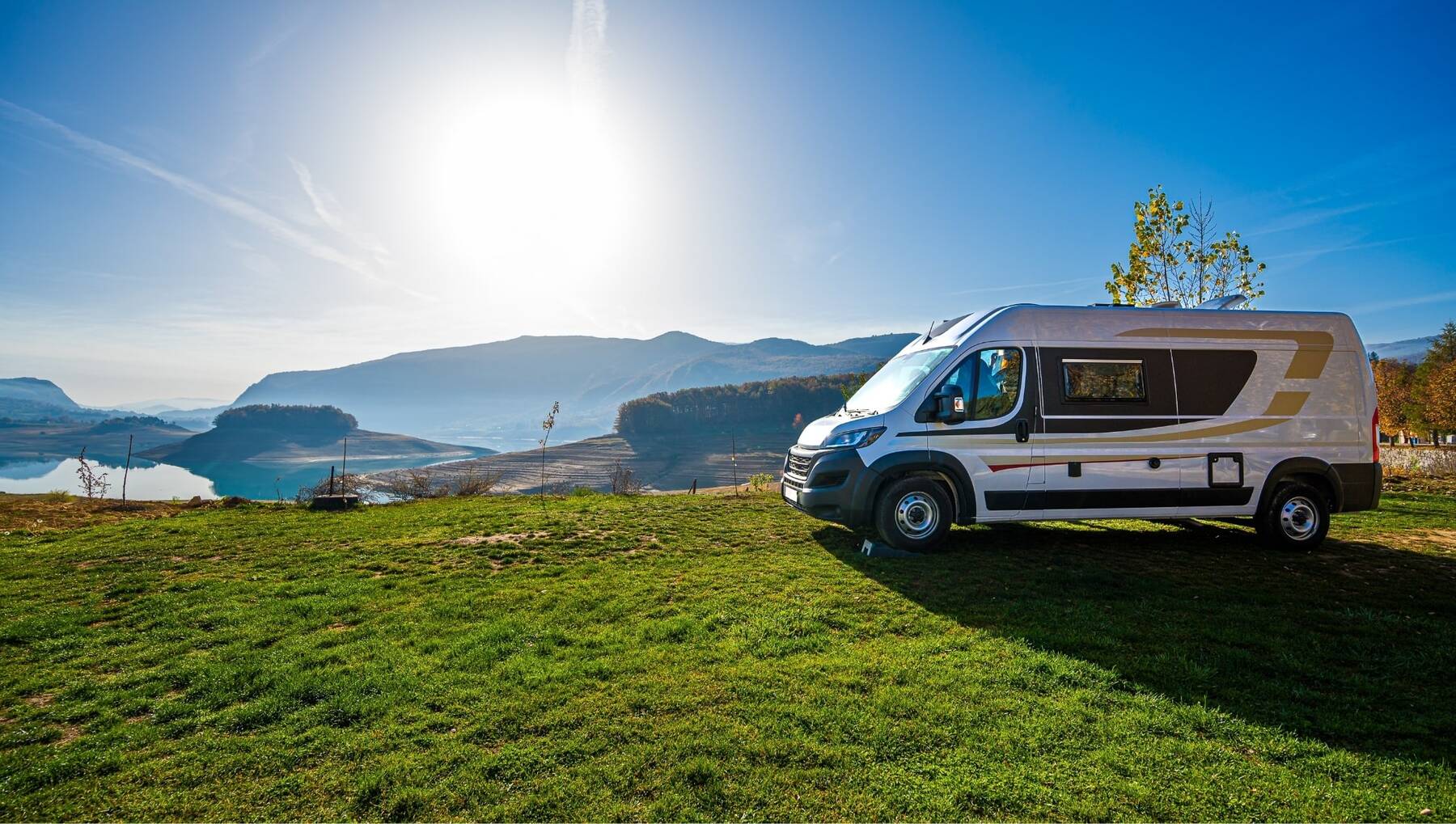 Motorhome on a lakeside meadow